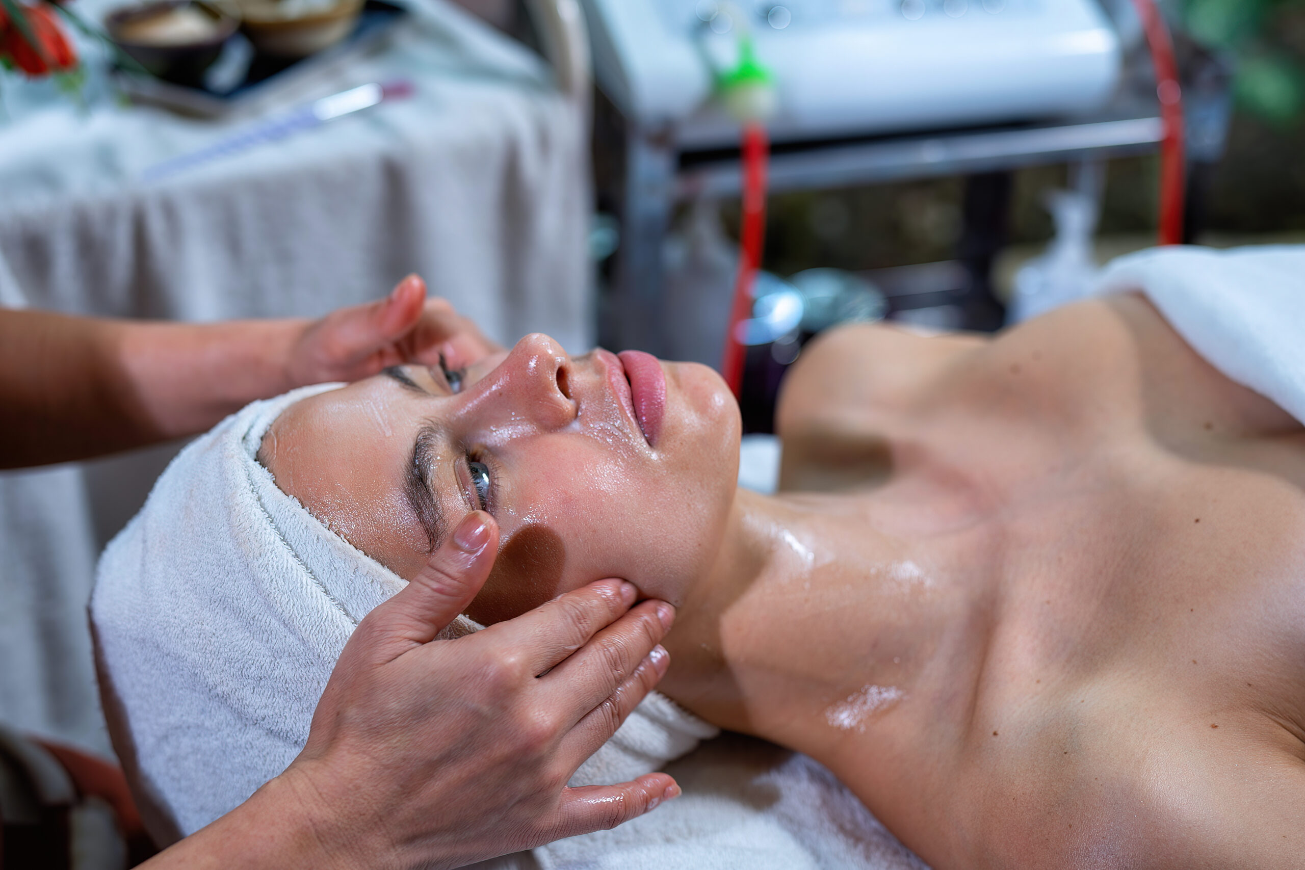 Beautiful young woman lying down on massage beds at luxury massage and spa and wellness center